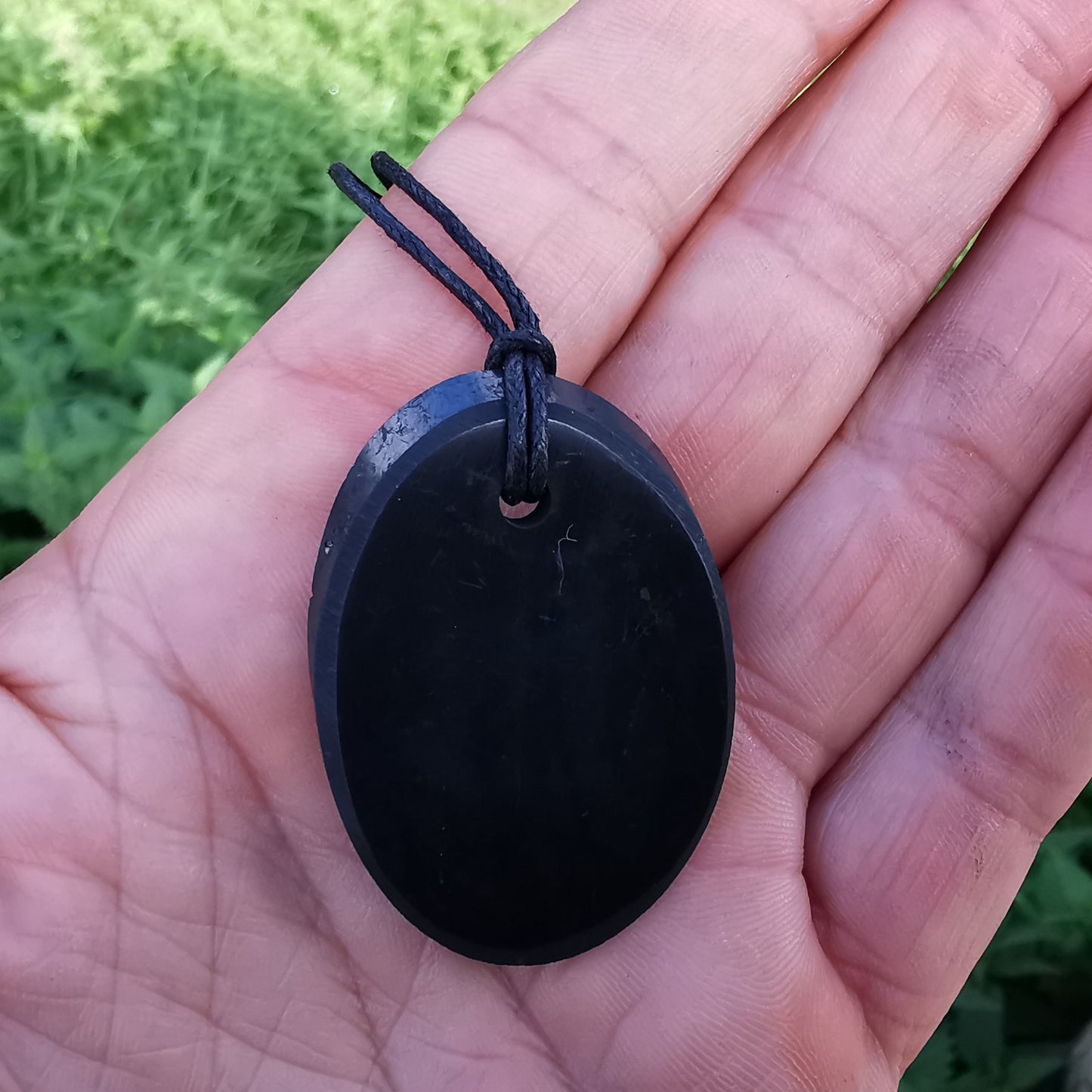 Shungite pendant oval with cotton ribbon